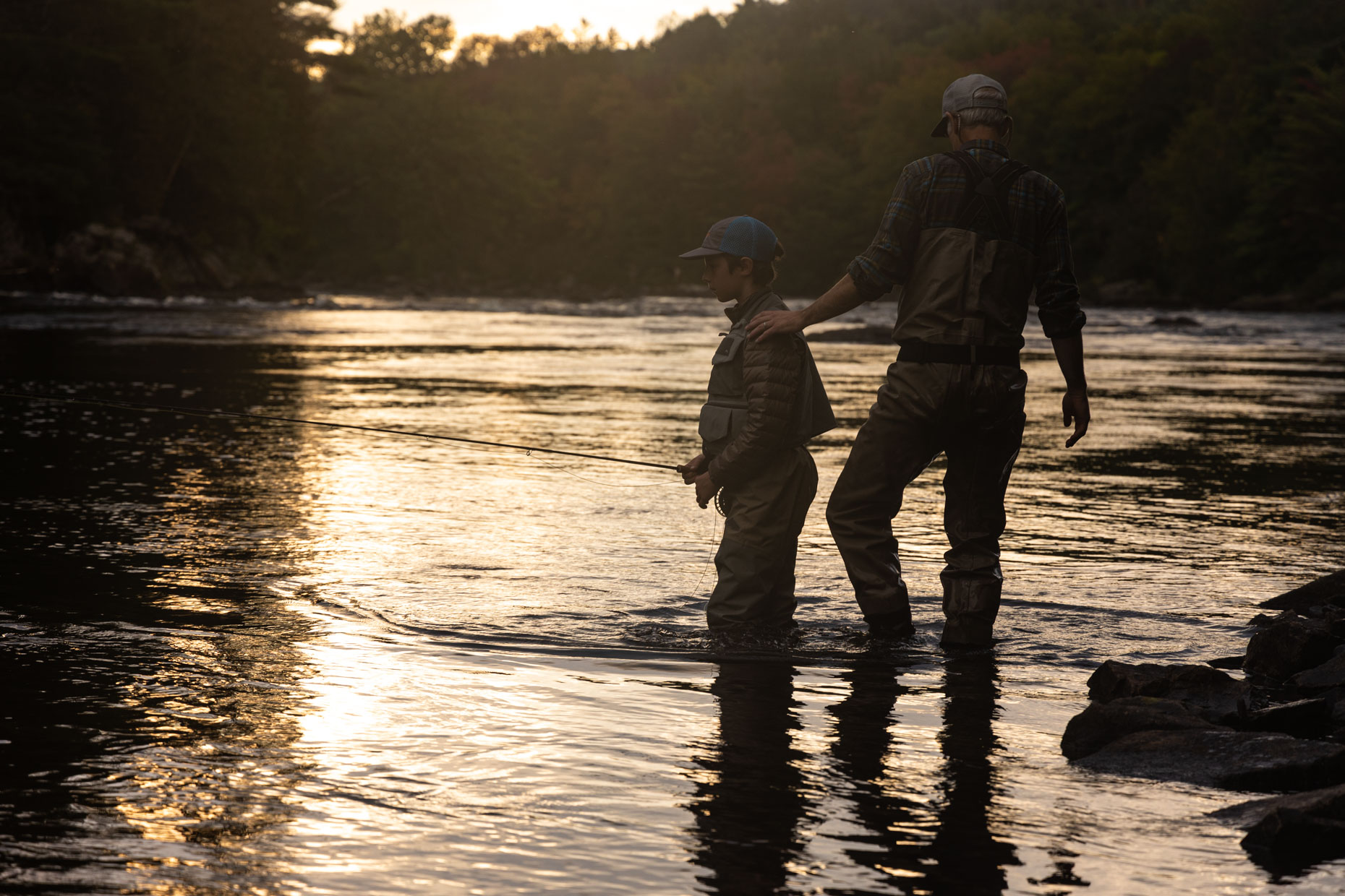 Father and son fly fishing on the West Branch of the Penobscot River, Maine